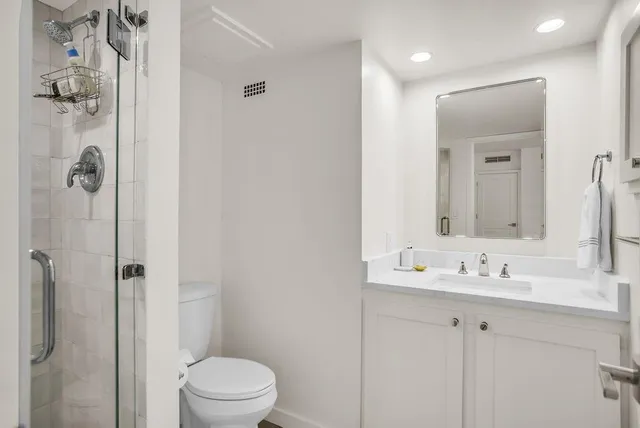 a living room with furniture and a book shelf