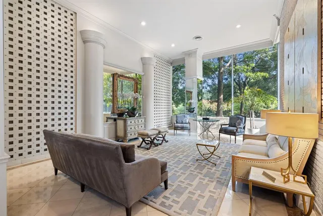 a view of a dining room with furniture and a window