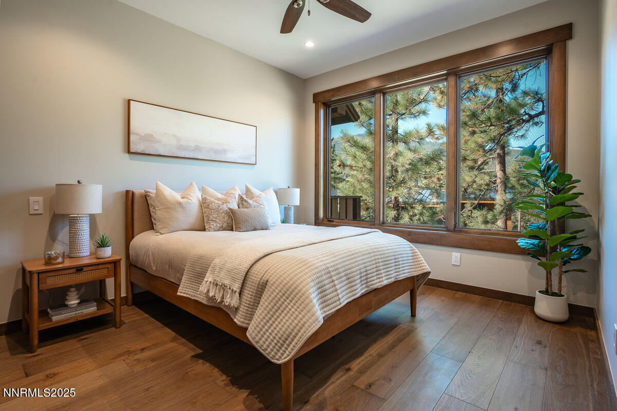 534 Headwaters Way Carson City, NV 89705 - Photo 12 of 39 a bedroom with a large bed and a potted plant