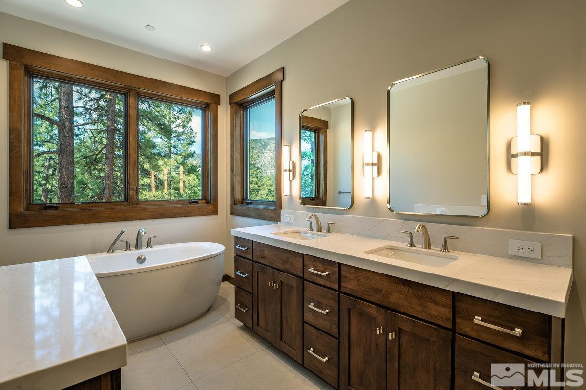 534 Headwaters Way Carson City, NV 89705 - Photo 13 of 39 a bathroom with a large tub sink and mirror