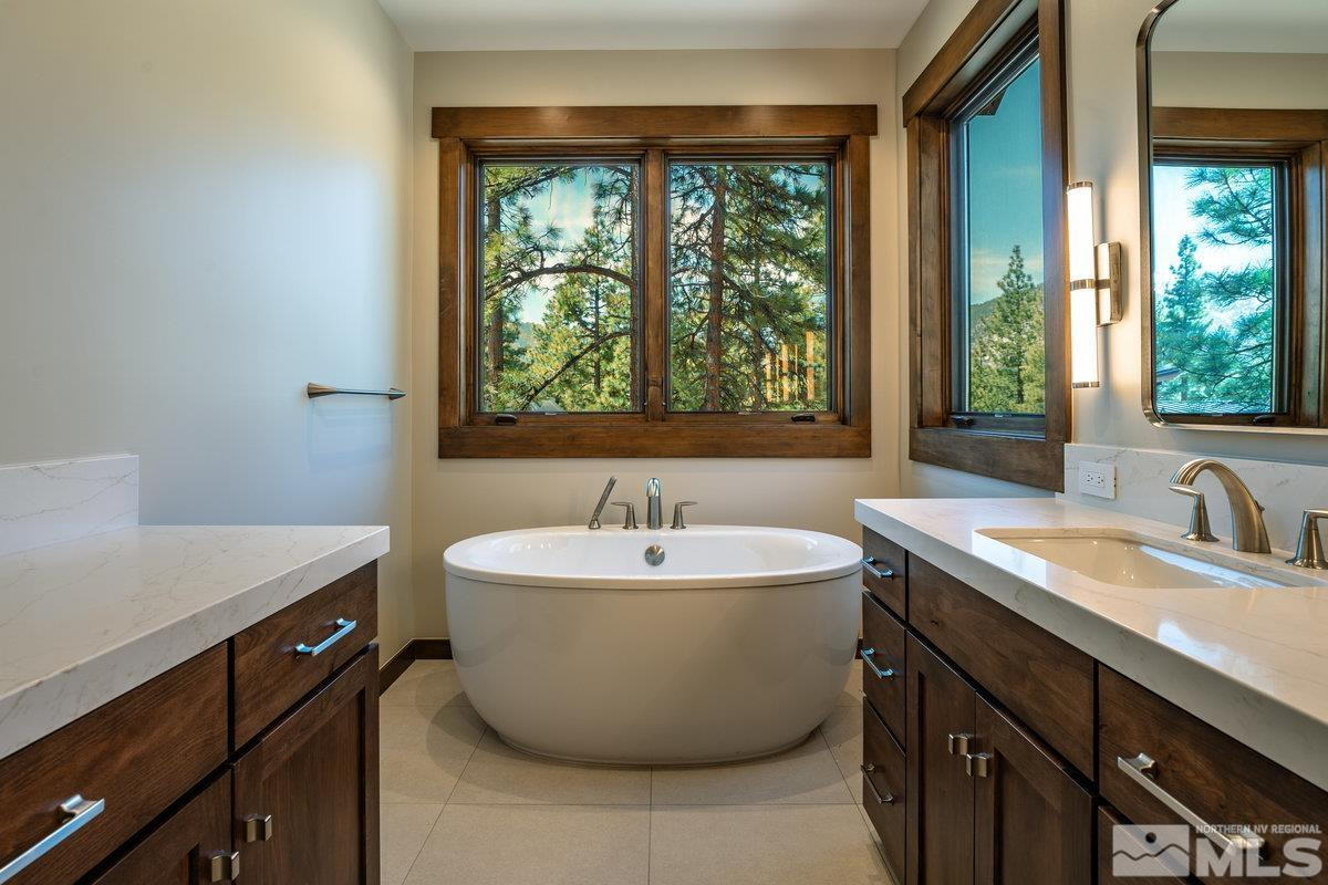 534 Headwaters Way Carson City, NV 89705 - Photo 14 of 39 a spacious bathroom with a sink and a bathtub