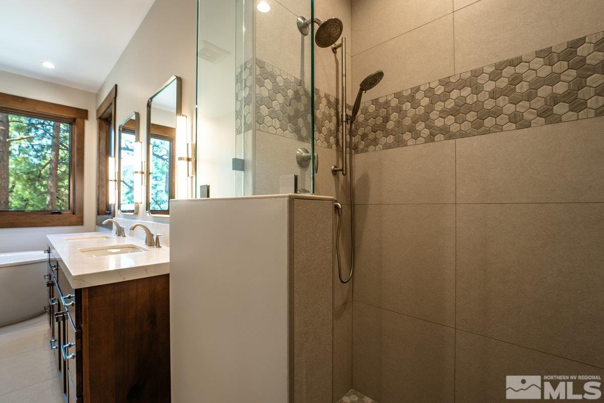 534 Headwaters Way Carson City, NV 89705 - Photo 16 of 39 a bathroom with a sink and shower