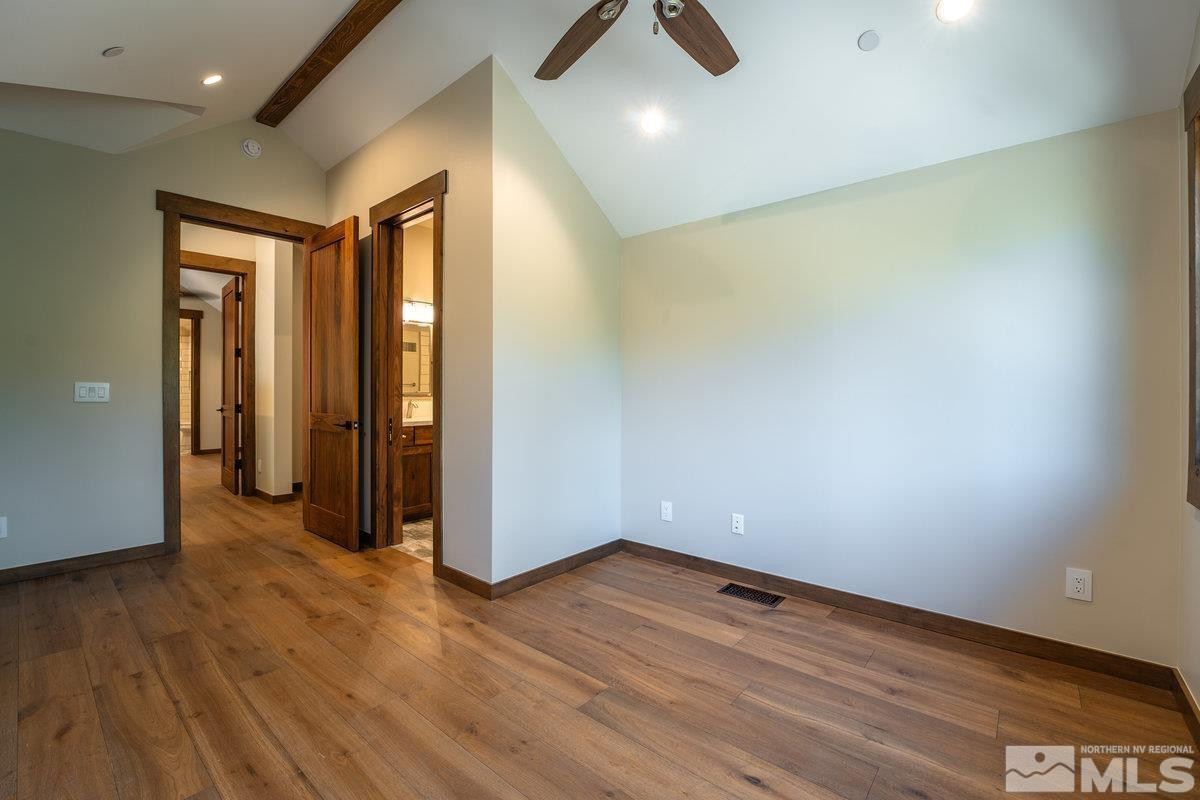 534 Headwaters Way Carson City, NV 89705 - Photo 18 of 39 an empty room with wooden floor and windows