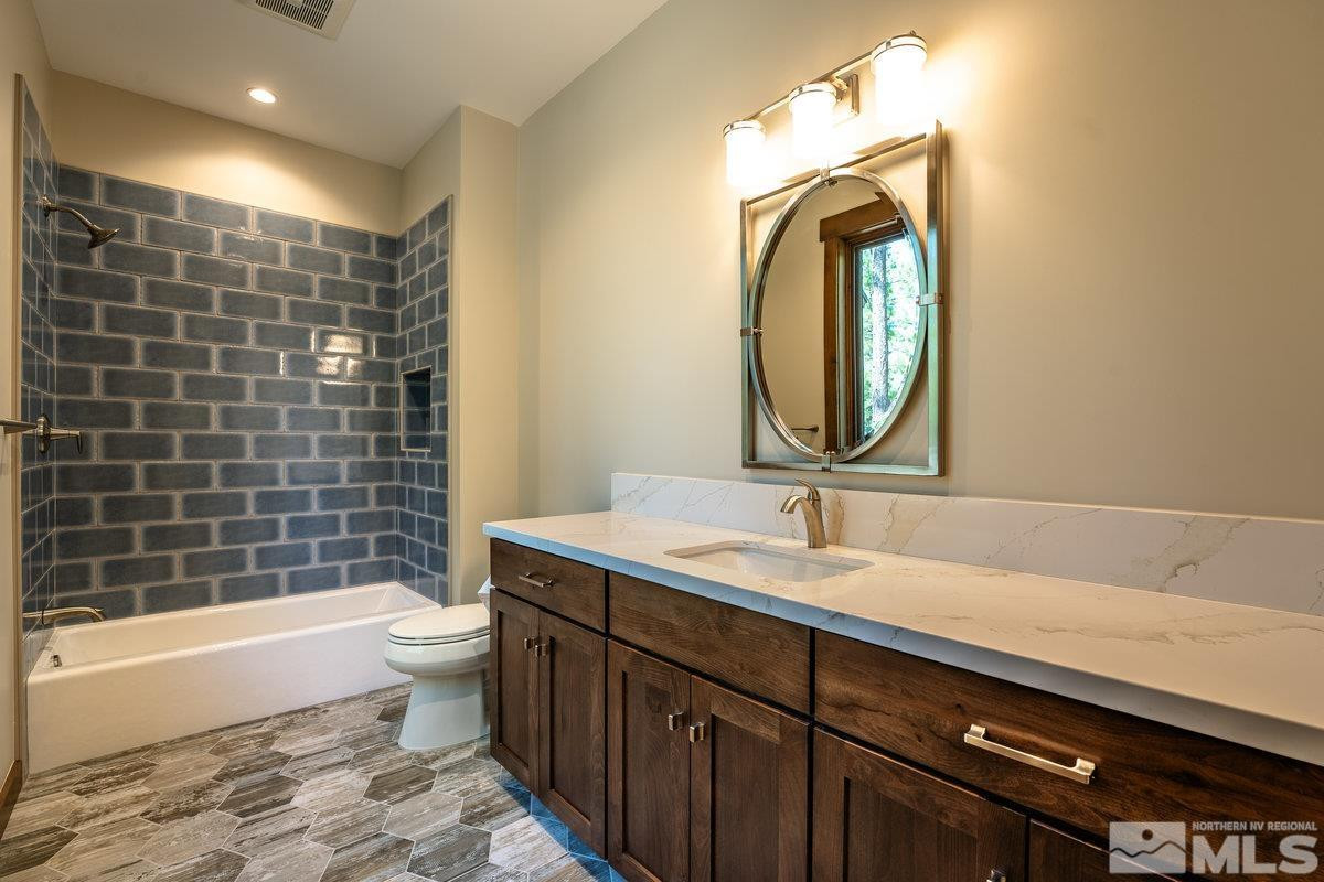 534 Headwaters Way Carson City, NV 89705 - Photo 19 of 39 a bathroom with a sink a toilet and shower