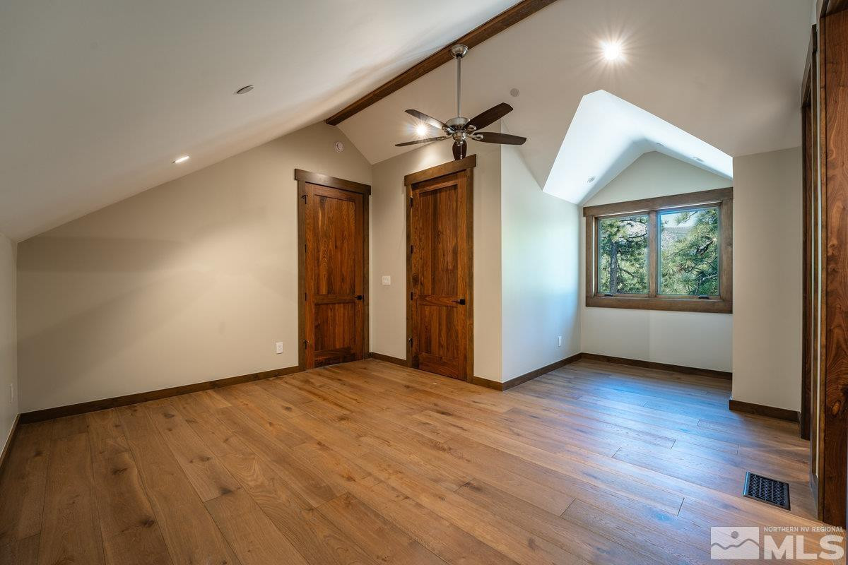 534 Headwaters Way Carson City, NV 89705 - Photo 21 of 39 a view of an empty room with wooden floor and a window