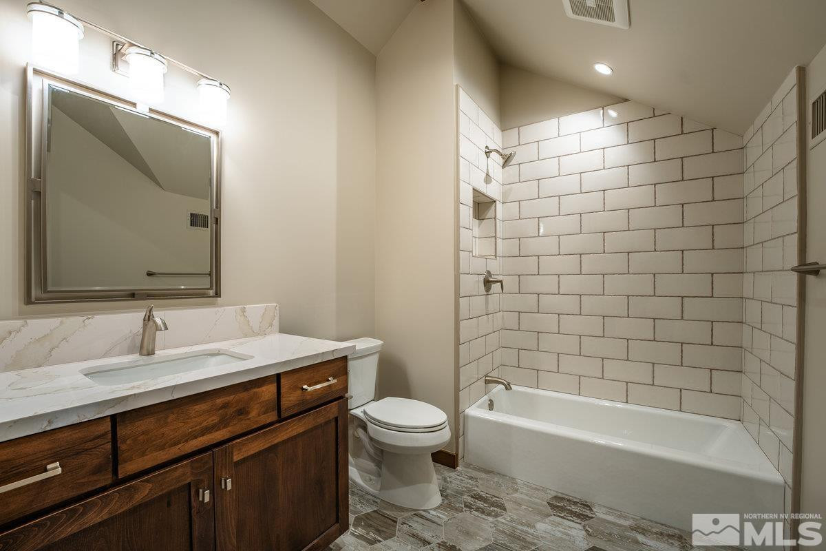 534 Headwaters Way Carson City, NV 89705 - Photo 22 of 39 a bathroom with a sink a toilet and shower