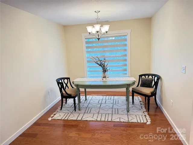 a view of a chairs and table in the patio