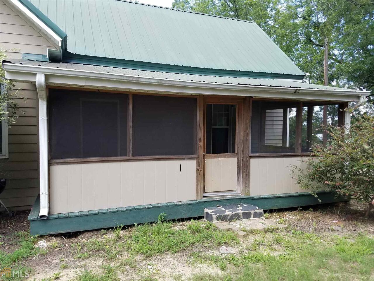 147 Mulberry Road Molena, GA 30258 - Photo 1 of 1 a house with trees in the background