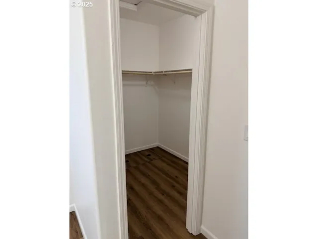 a view of an empty walk in a closet