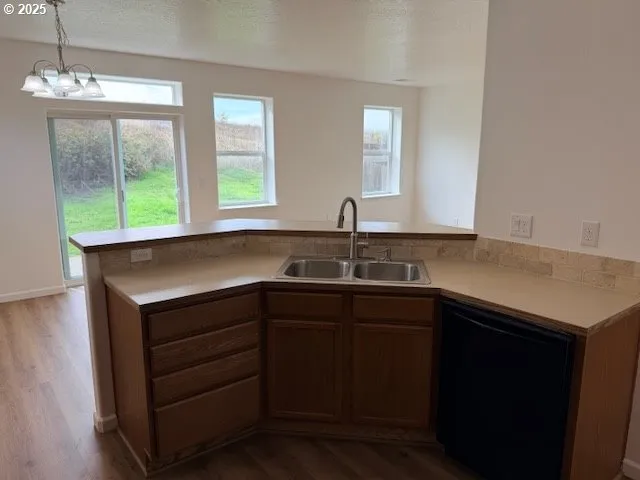 a kitchen with a sink and a window