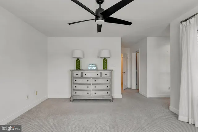 a room with a dresser and a window