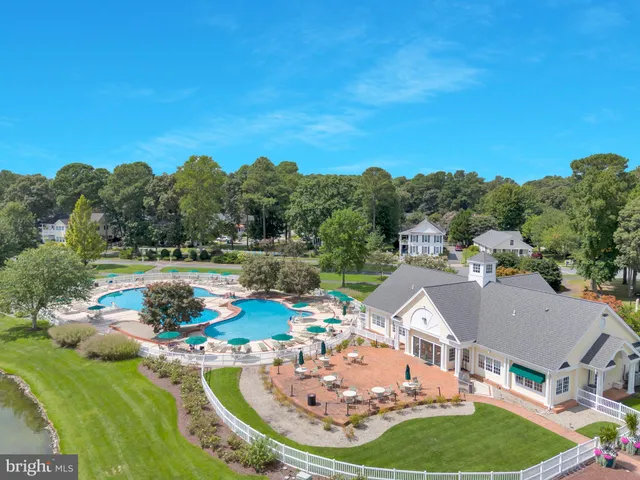an aerial view of a house swimming pool outdoor seating and yard