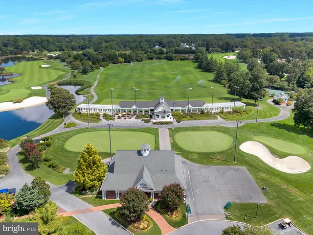 an aerial view of a houses with outdoor space and lake view