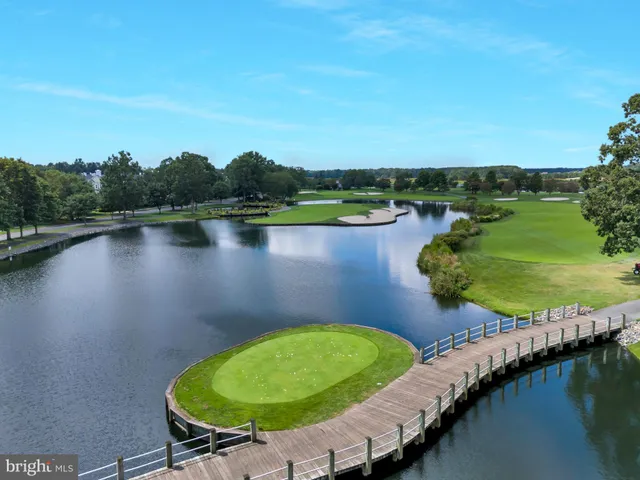 an aerial view of a house with outdoor space and lake view