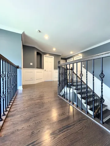 a view of staircase with wooden floor and stairs