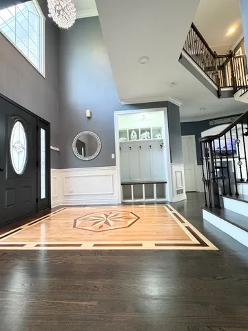 a view of a room with wooden floor