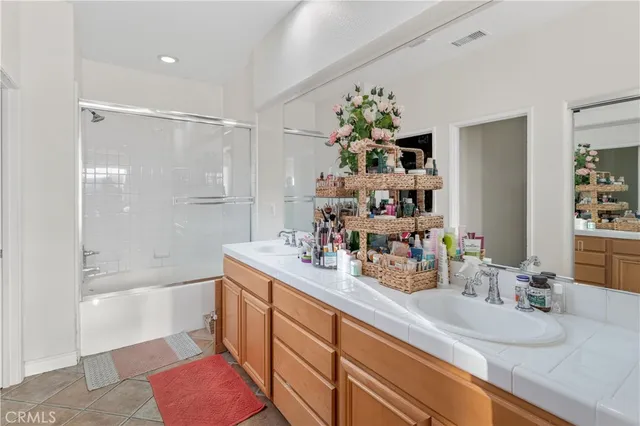 a bedroom with a bed and a bookshelf