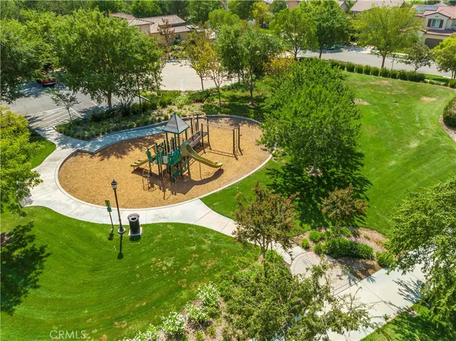 a view of a park with swings and slides