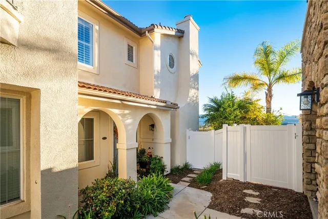a view of a house with a small yard
