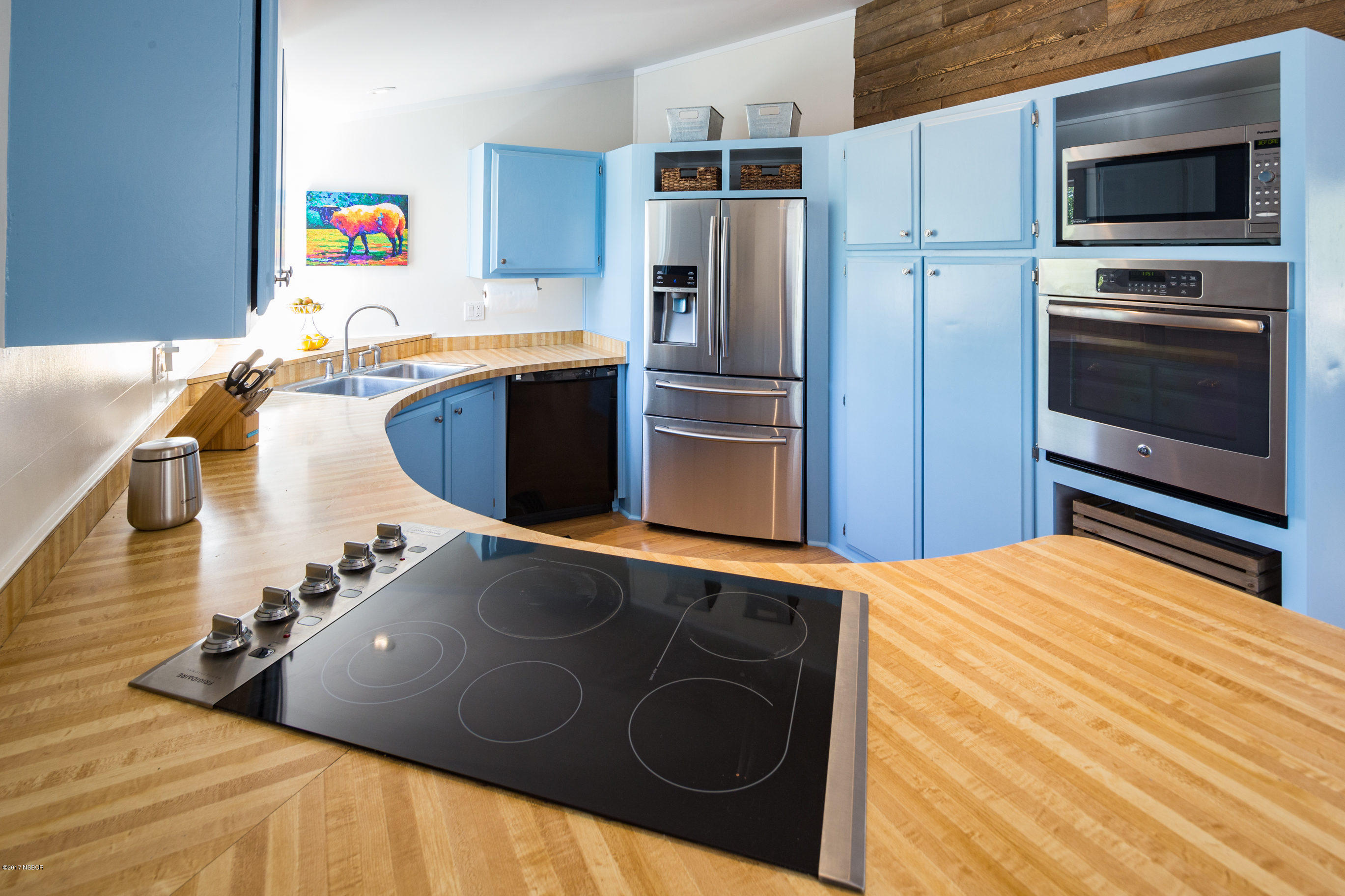 2075 North Refugio Road Santa Ynez, CA 93460 - Photo 13 of 46 a kitchen with stainless steel appliances granite countertop a sink a stove a microwave and a refrigerator