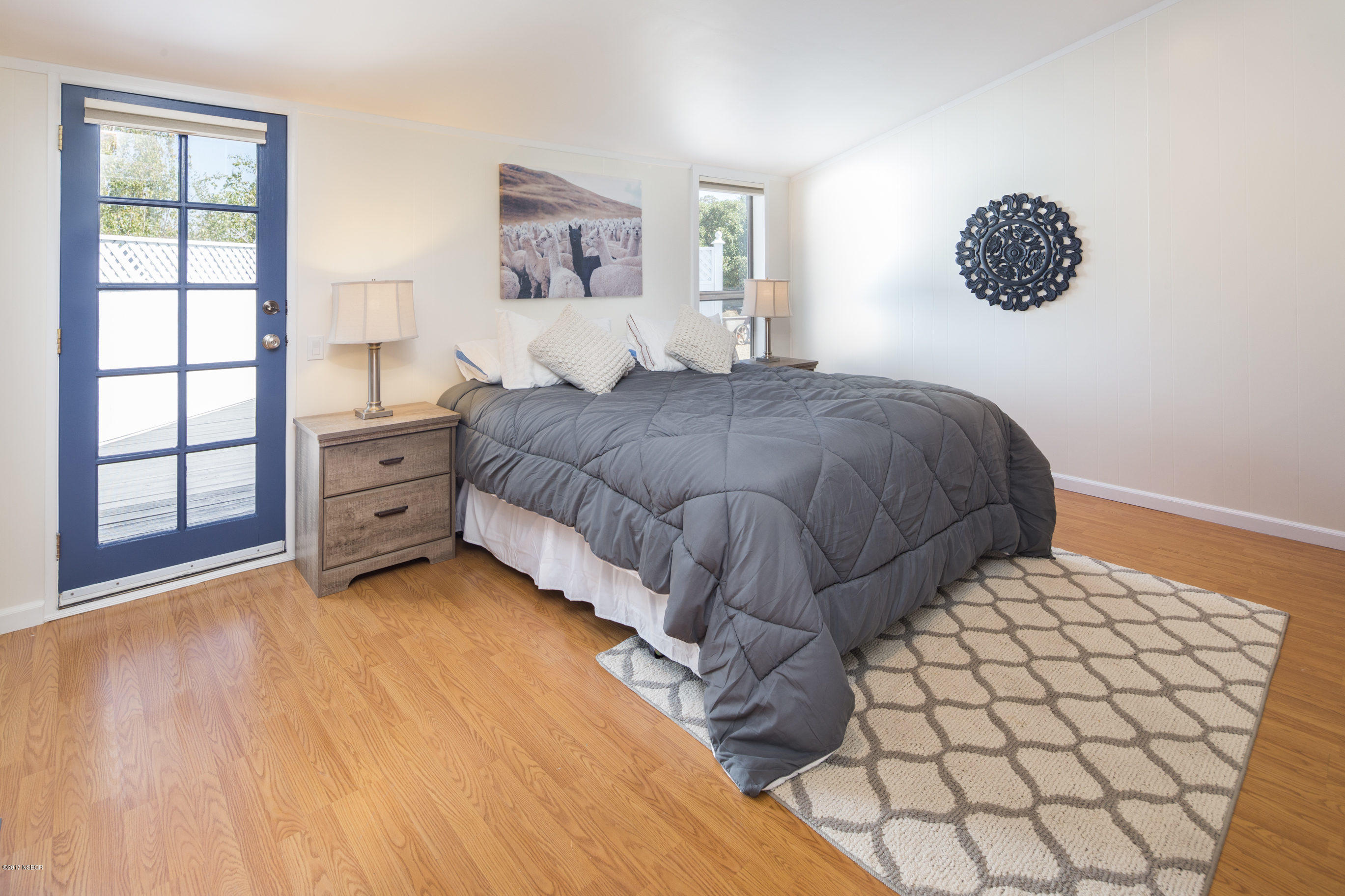 2075 North Refugio Road Santa Ynez, CA 93460 - Photo 17 of 46 a bedroom with a bed and a window
