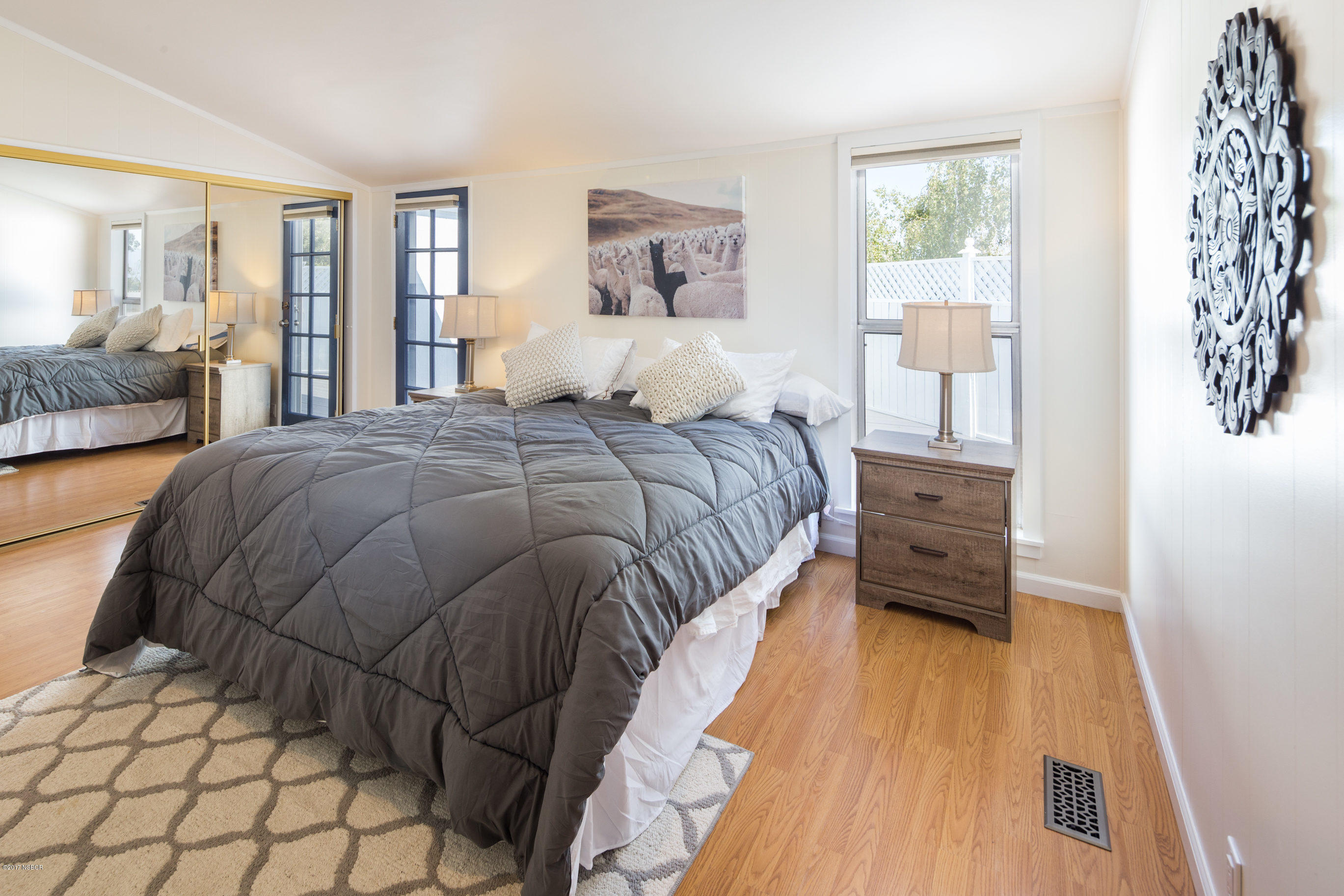 2075 North Refugio Road Santa Ynez, CA 93460 - Photo 18 of 46 a bedroom with a bed and a large window