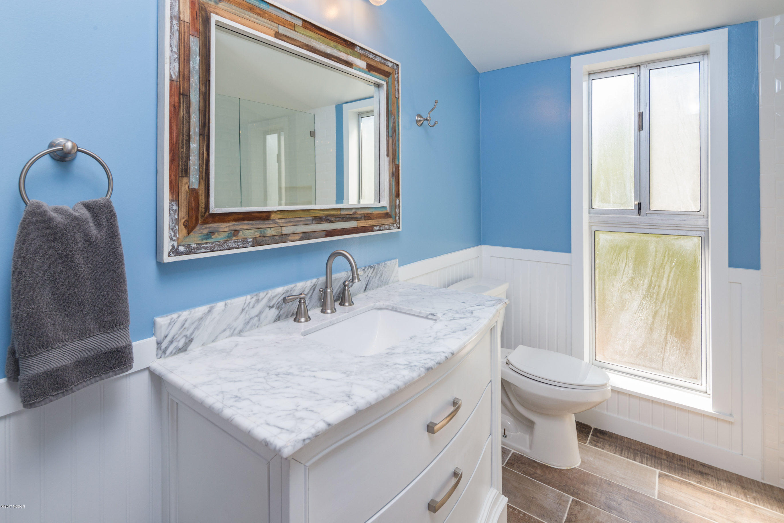 2075 North Refugio Road Santa Ynez, CA 93460 - Photo 28 of 46 a bathroom with a granite countertop sink and a mirror
