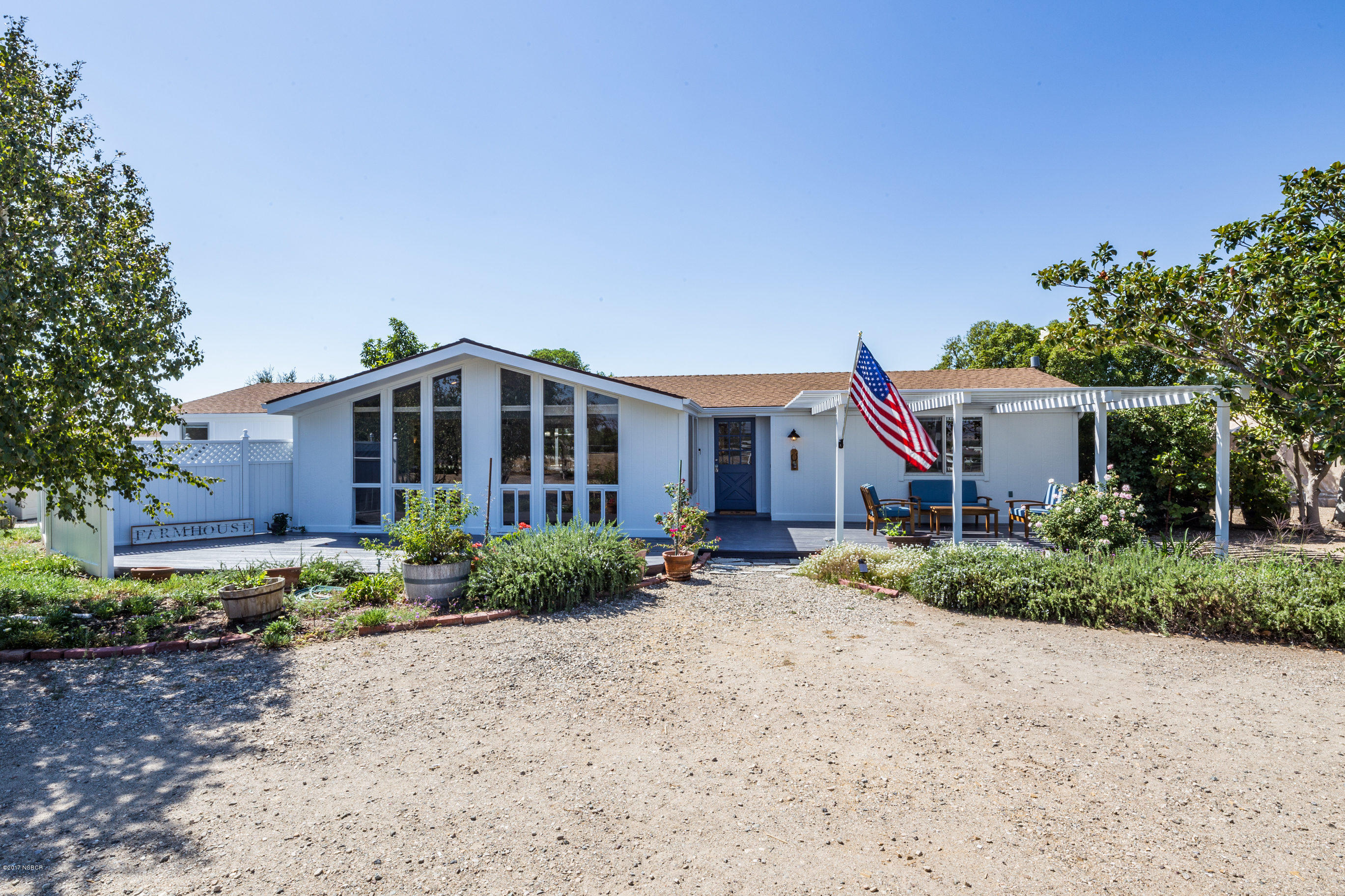 2075 North Refugio Road Santa Ynez, CA 93460 - Photo 3 of 46 a front view of house with yard space and trees around