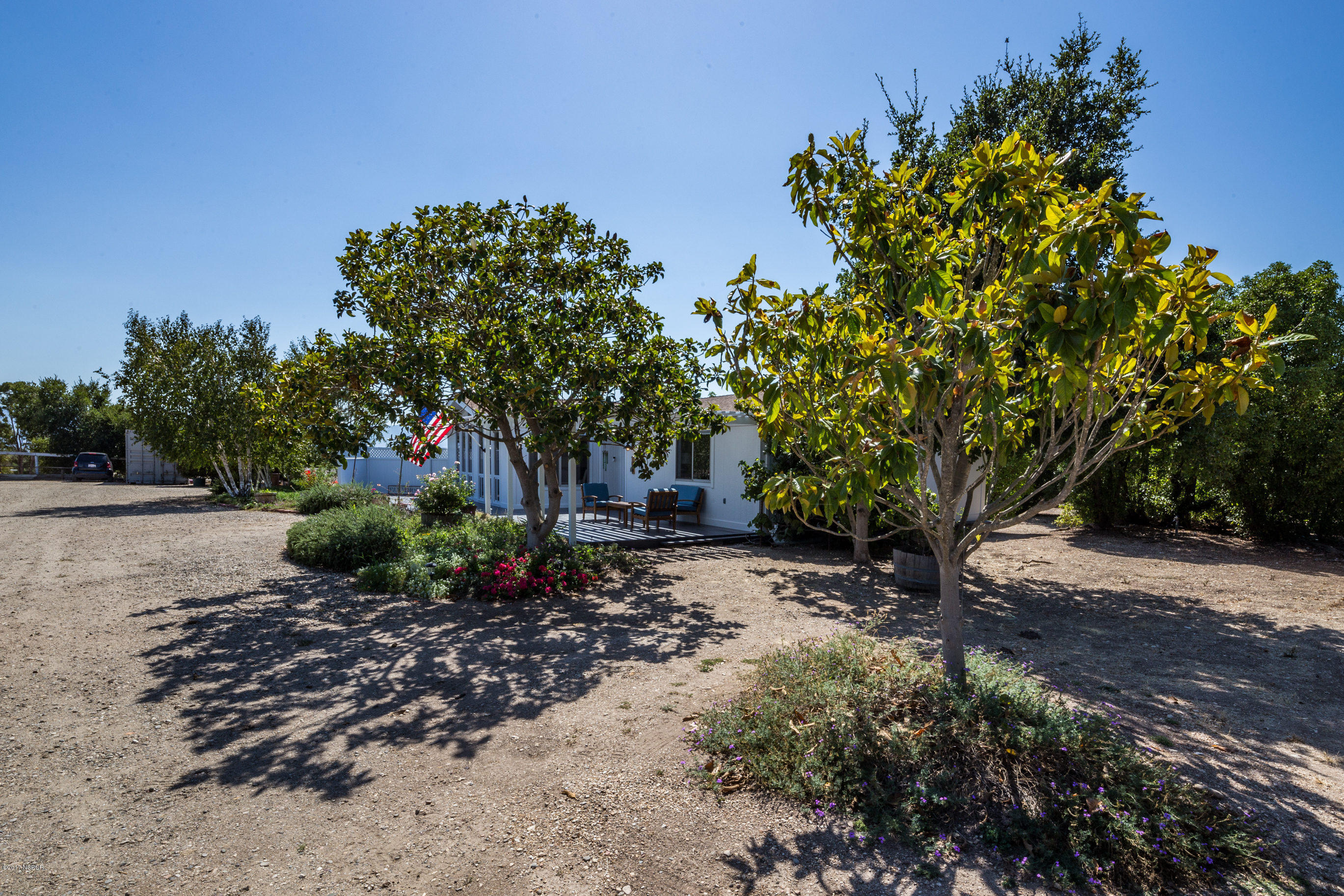 2075 North Refugio Road Santa Ynez, CA 93460 - Photo 32 of 46 a backyard of a house with lots of green space