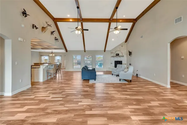 a kitchen with stainless steel appliances granite countertop a stove and a microwave