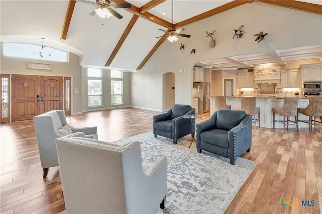 a view of a kitchen with wooden floor and furniture