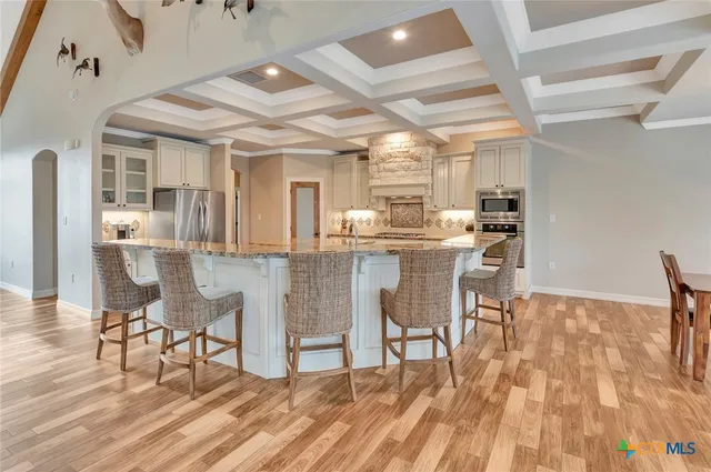 a spacious bathroom with a tub sink and shower