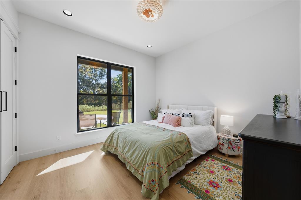 8701 Zebra Crossing Larue, TX 75770 - Photo 23 of 38 a bedroom with a bed and a window