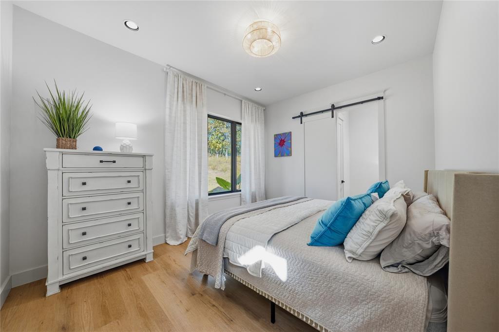 8701 Zebra Crossing Larue, TX 75770 - Photo 8 of 38 a bedroom with a bed and a window