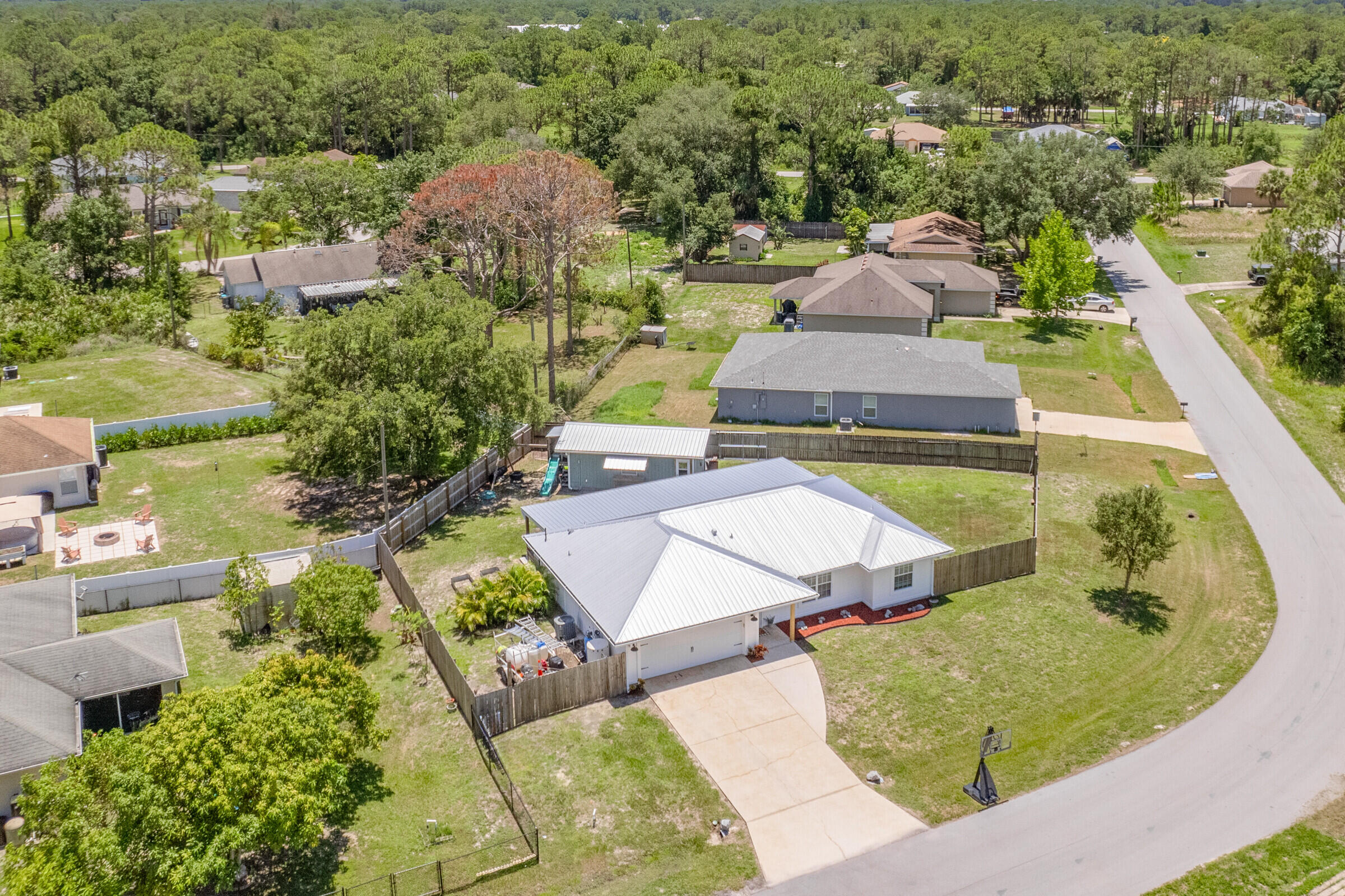 1030 San Rafael Road Southwest Palm Bay, FL 32908 - Photo 31 of 37 an aerial view of a house with yard swimming pool and outdoor seating