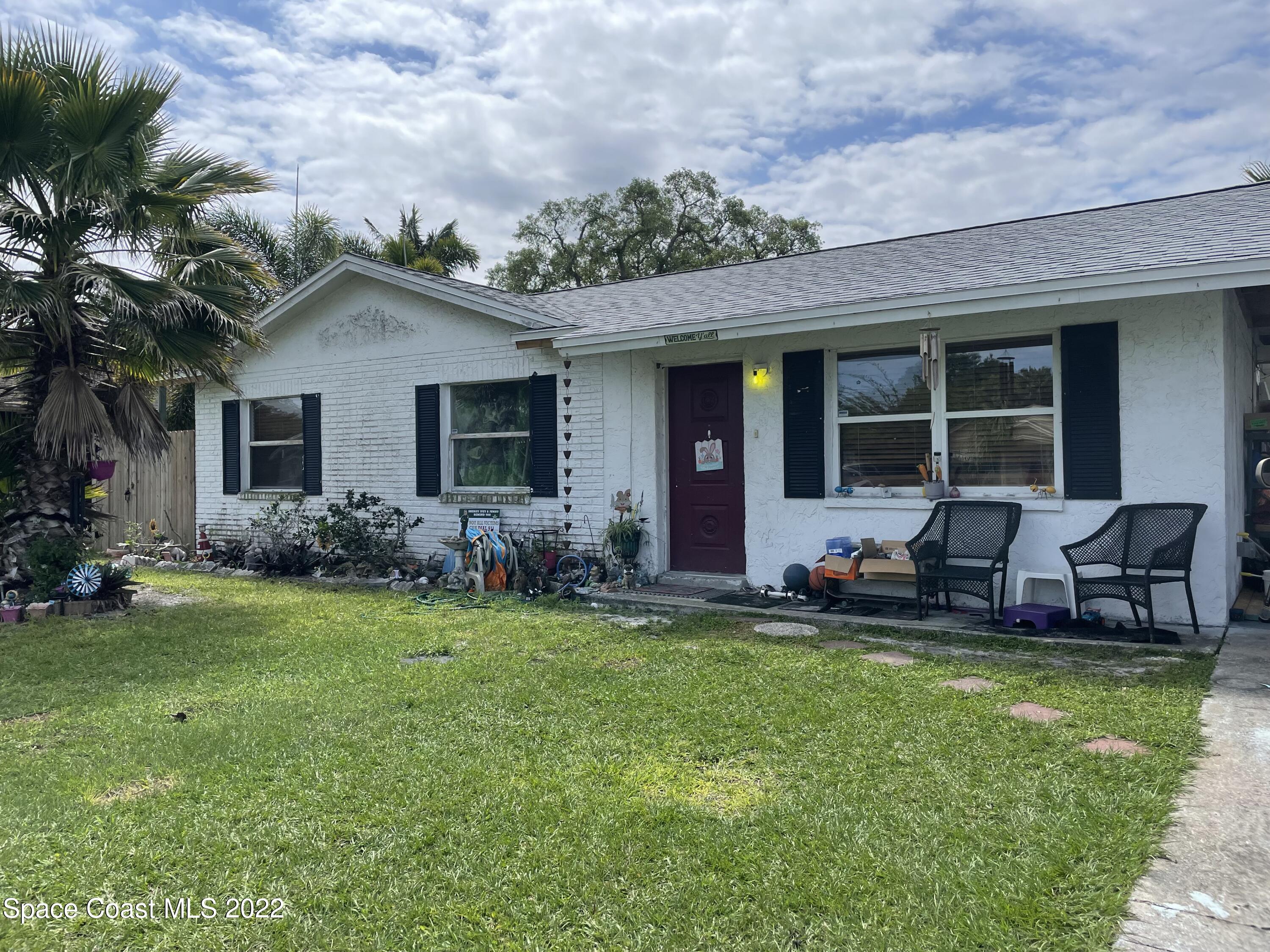 2795 Lancaster Road Melbourne, FL 32935 - Photo 1 of 1 a front view of house with yard and outdoor seating