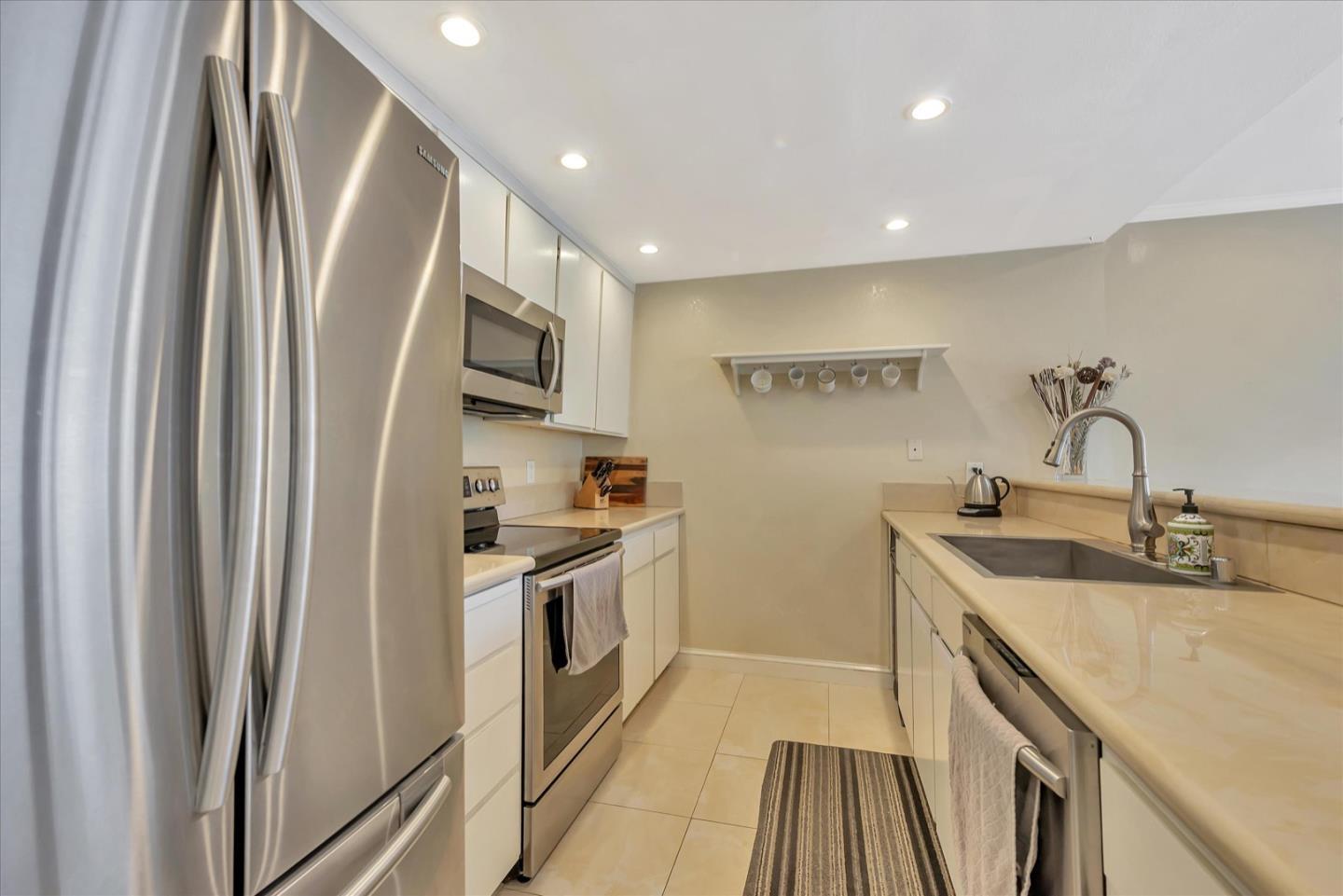 3415 La Selva Street San Mateo, CA 94403 - Photo 12 of 33 a kitchen with stainless steel appliances granite countertop a refrigerator and a sink