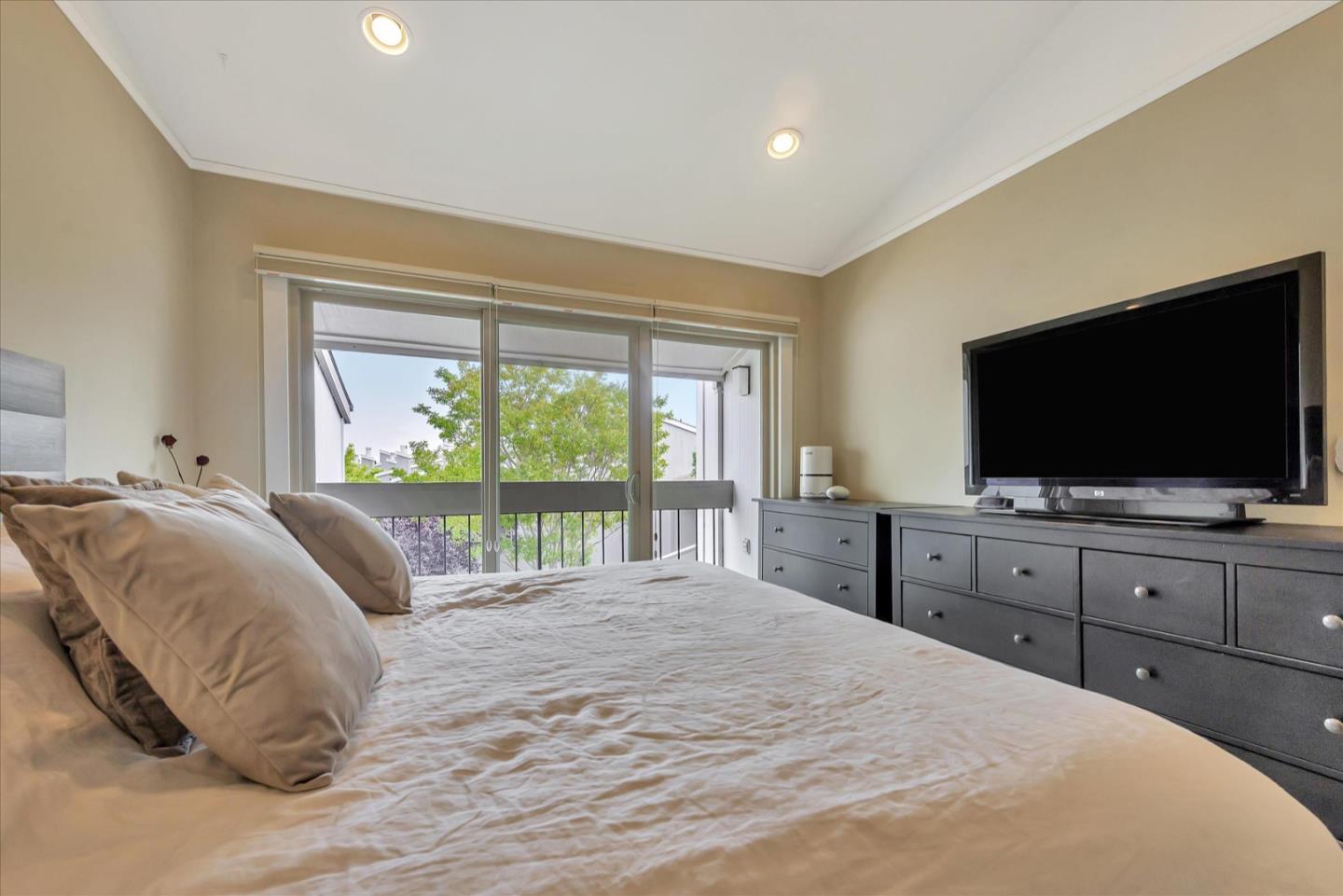 3415 La Selva Street San Mateo, CA 94403 - Photo 15 of 33 a bedroom with a large bed and a flat screen tv