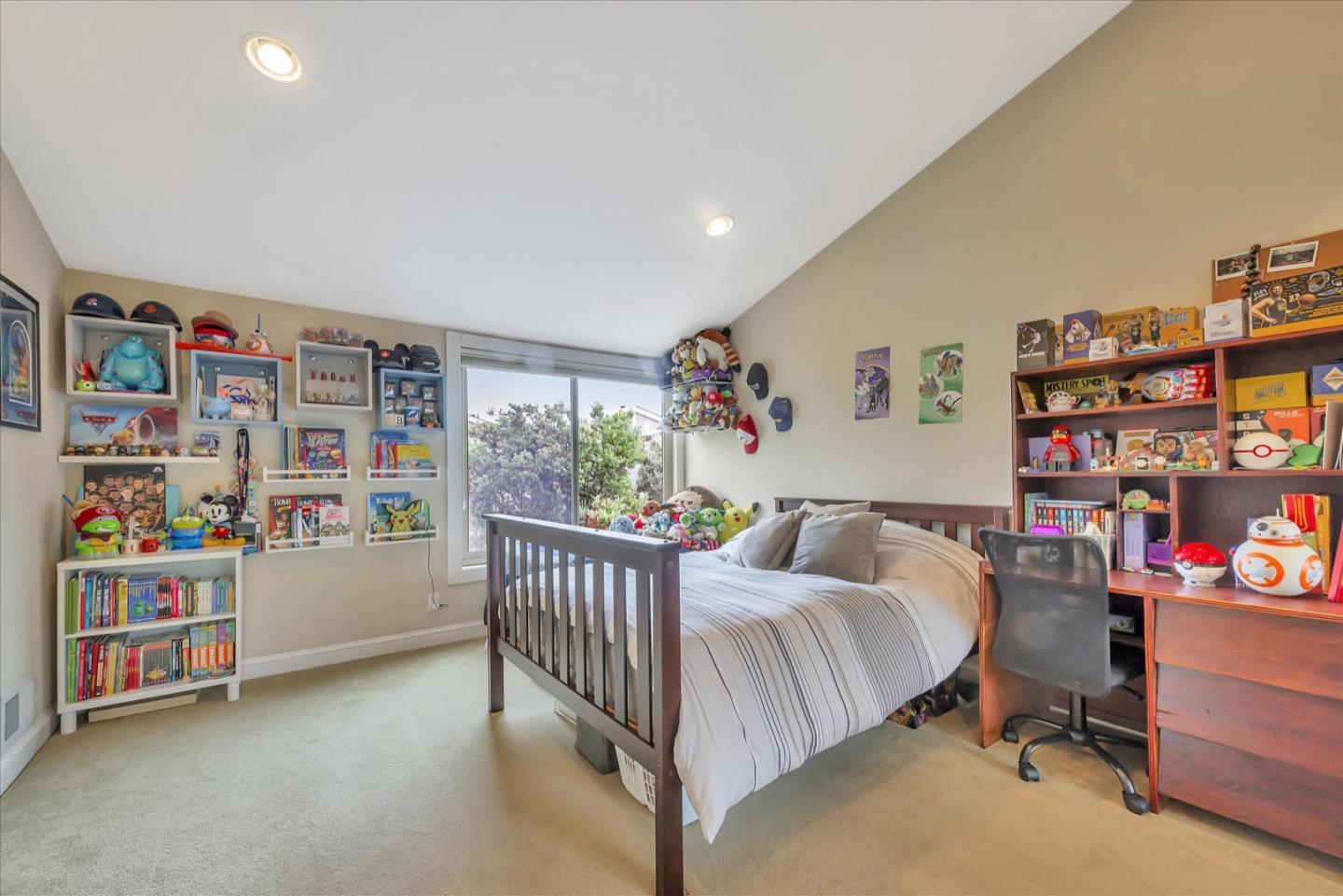 3415 La Selva Street San Mateo, CA 94403 - Photo 20 of 33 a bedroom with furniture and a book shelf