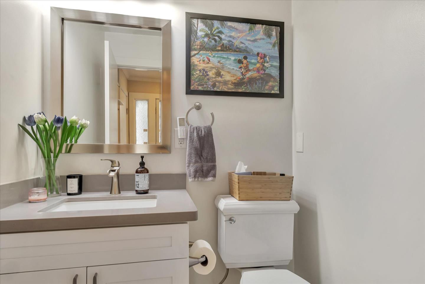 3415 La Selva Street San Mateo, CA 94403 - Photo 24 of 33 a bathroom with a toilet a sink and mirror
