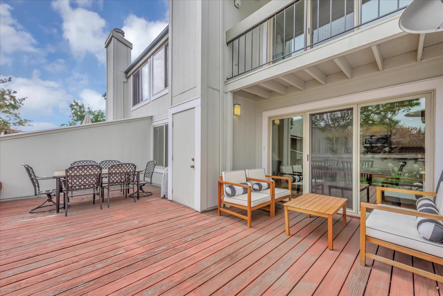 3415 La Selva Street San Mateo, CA 94403 - Photo 26 of 33 a balcony with wooden floor table and chairs