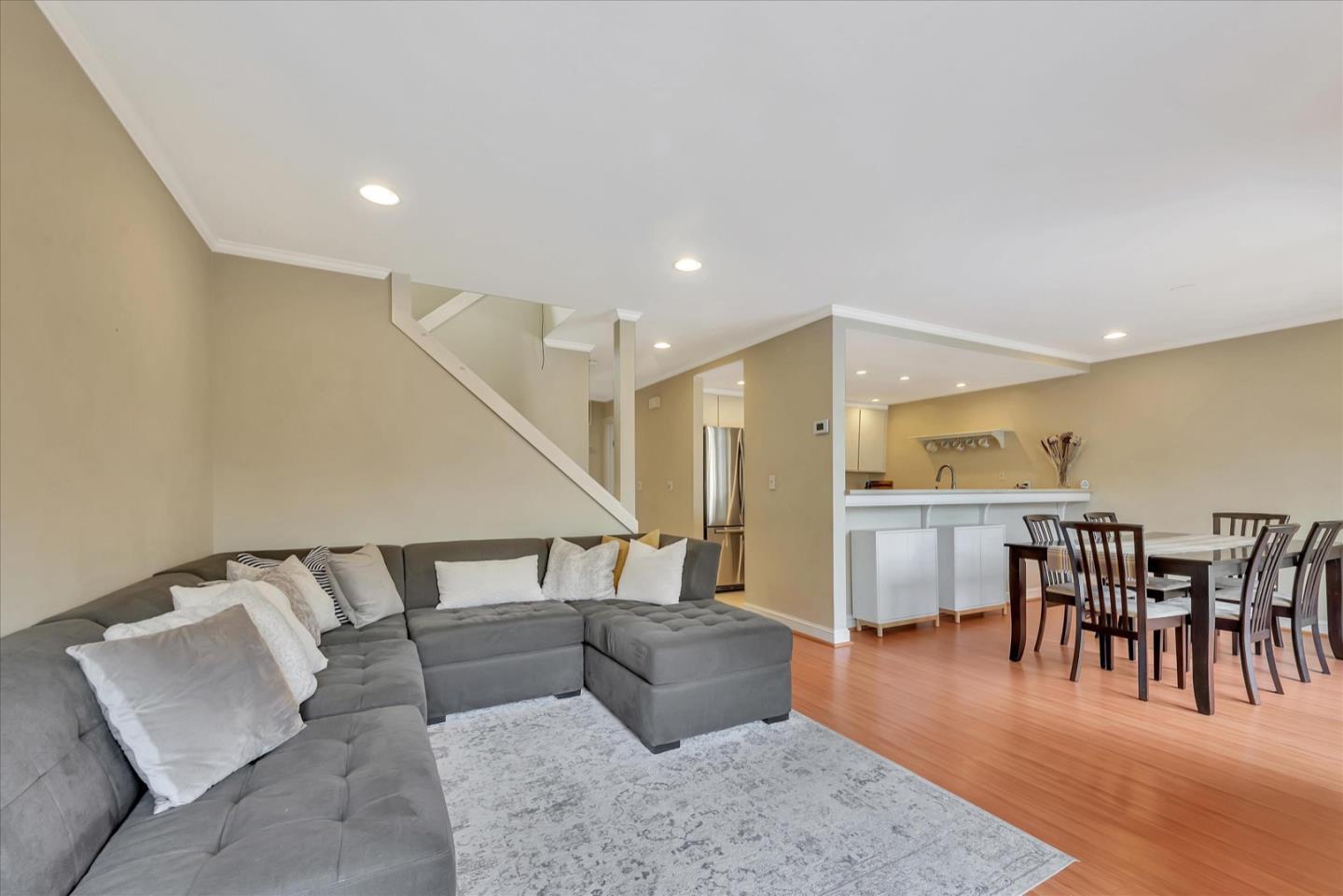 3415 La Selva Street San Mateo, CA 94403 - Photo 4 of 33 a living room with furniture and a dining table with wooden floor