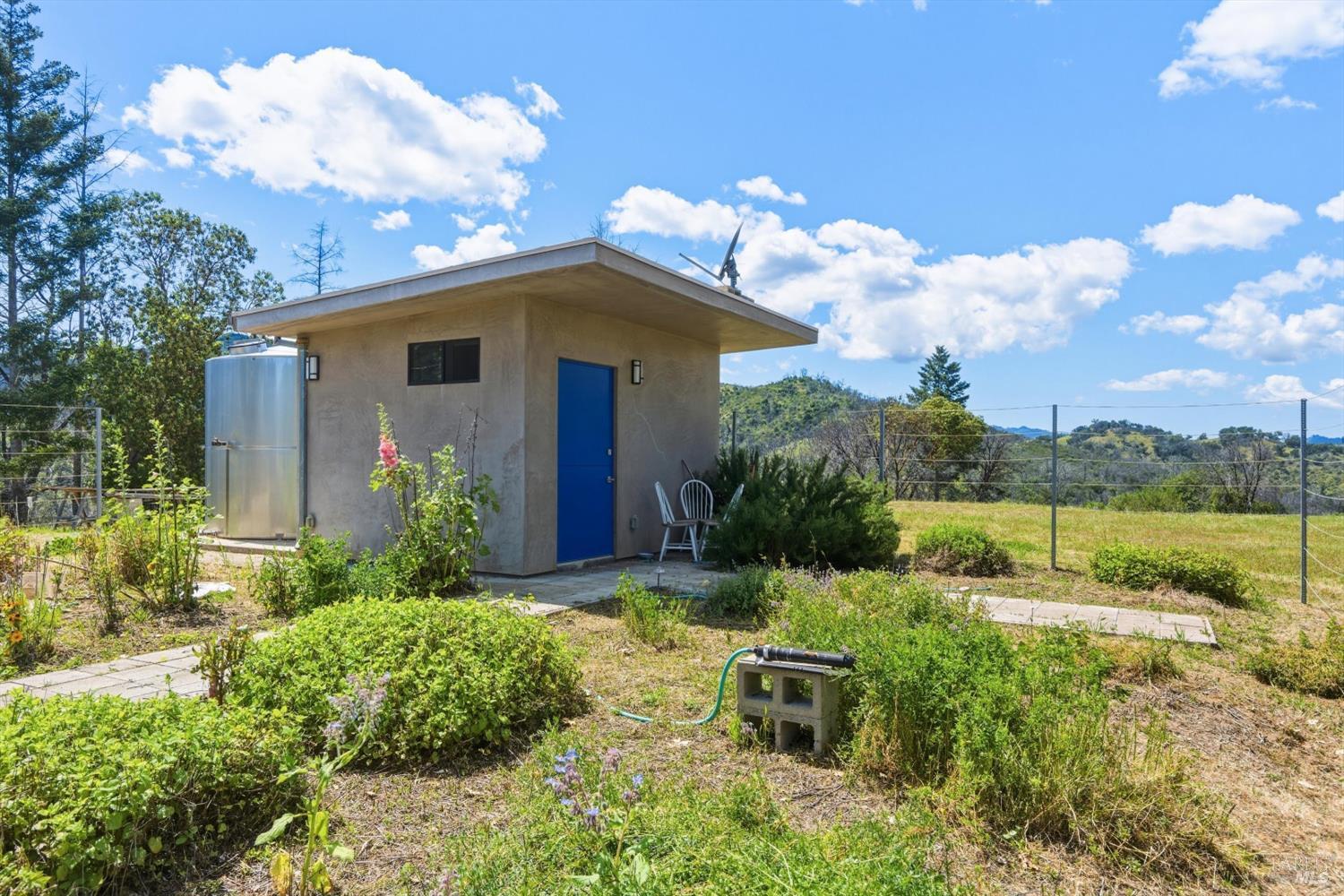 3444 Chicken Ridge Road Healdsburg, CA 95448 - Photo 6 of 21 a front view of a house with garden