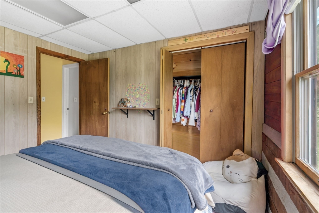 22 Lyon Hill Road Chester, MA 01011 - Photo 27 of 38 a bedroom with a bed and a window