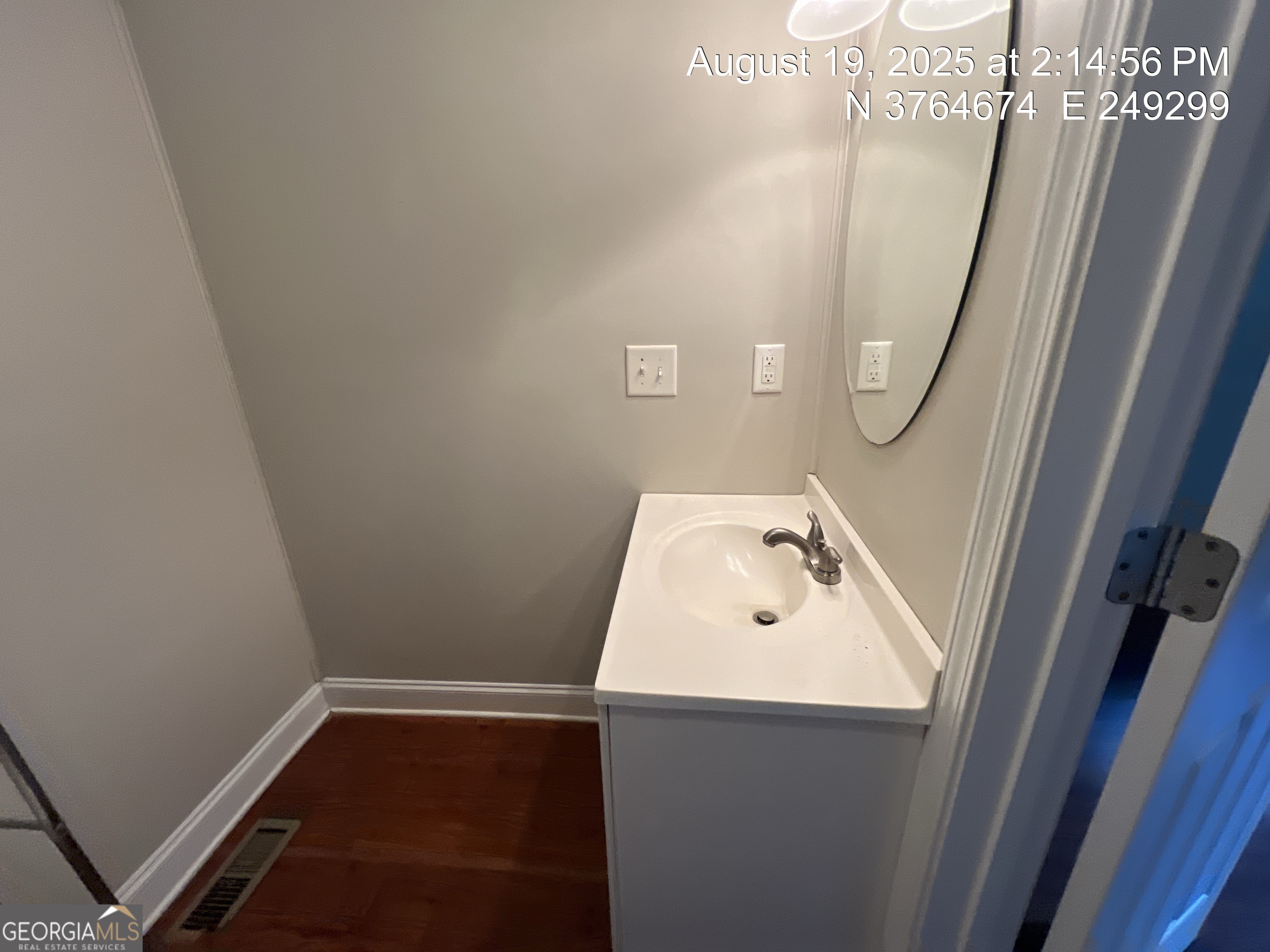 186 Georgia Avenue, Unit B Winder, GA 30680 - Photo 14 of 24 a bathroom with a sink and mirror