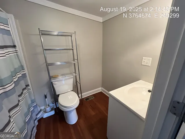 a bathroom with a toilet and a bathtub