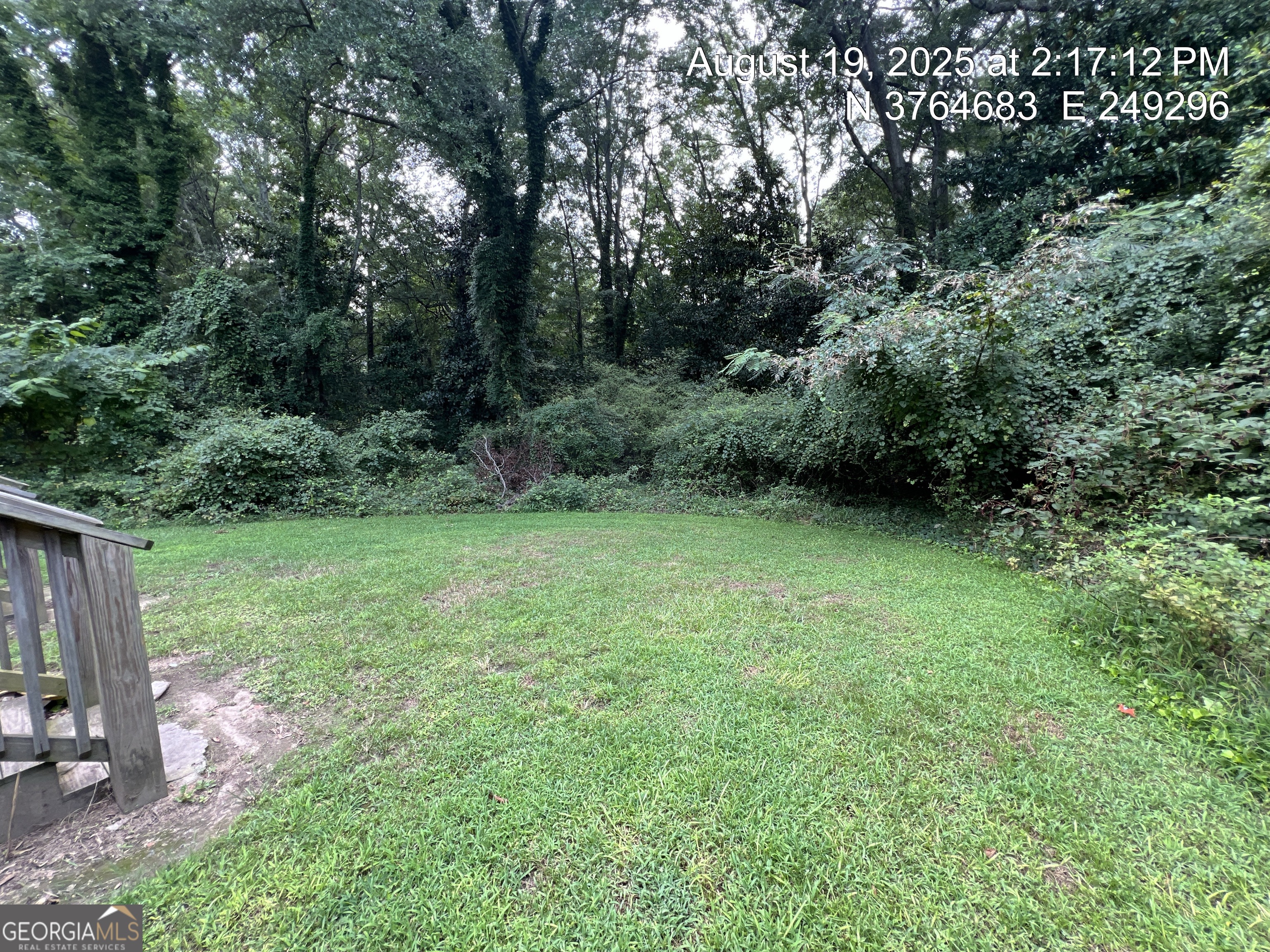 186 Georgia Avenue, Unit B Winder, GA 30680 - Photo 20 of 24 a view of a yard with a tree