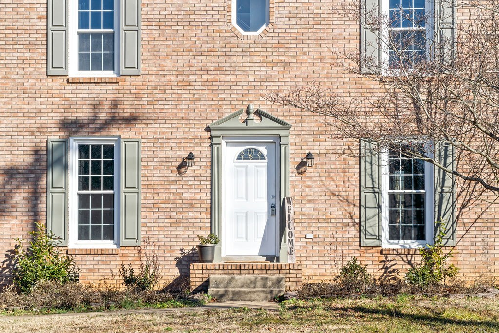 1909 Needmore Road Clarksville, TN 37042 - Photo 2 of 24 a front view of a house with a yard