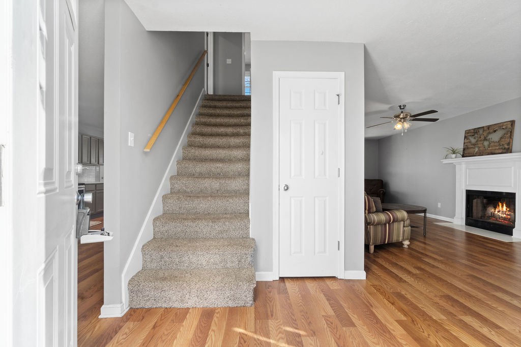 1909 Needmore Road Clarksville, TN 37042 - Photo 11 of 24 a view of a livingroom with wooden floor and stairs