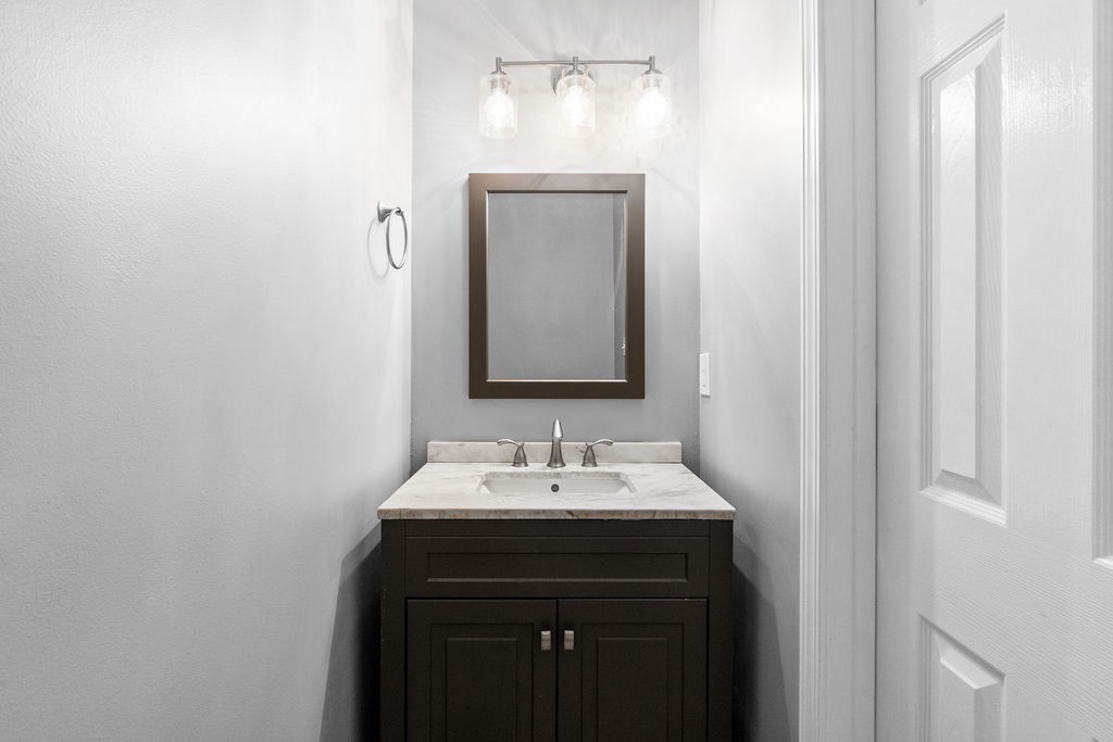 1909 Needmore Road Clarksville, TN 37042 - Photo 13 of 24 a bathroom with a sink and a mirror